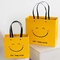 Του ISO ανθεκτική στους κραδασμούς χαμόγελου προσώπου της Kraft εγγράφου τσάντα κατώτατου εγγράφου τσαντών κίτρινη τετραγωνική